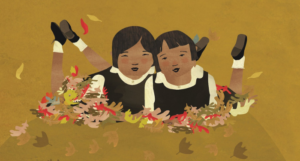 a cropped cover of When We Were Alone showing an illustration of two Indigenous kids smiling while surrounded with autumn leaves