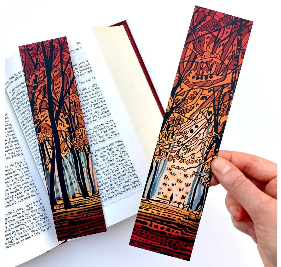 Image of two bookmarks featuring a forest decked out in fall colors. 