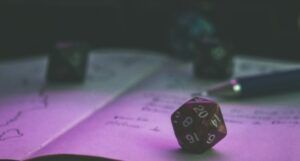 image of a d20 on an open notebook