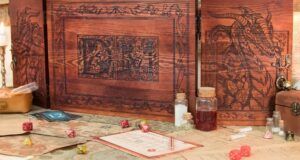 a photo of a wooden Dungeon Master screen with a dragon illustration on it