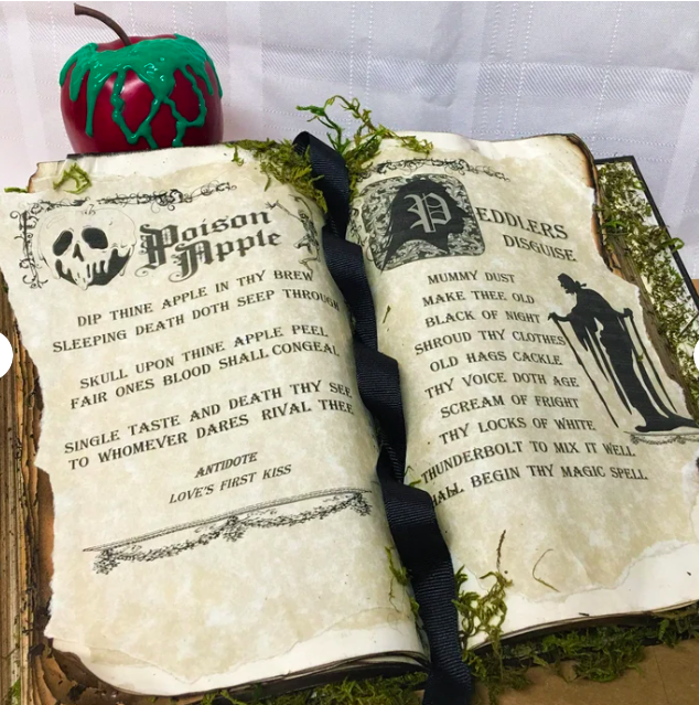 A book styled to look like a spell book with a poison apple recipe