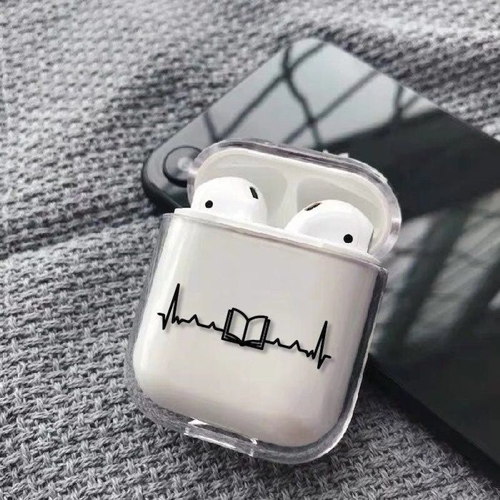 clear AirPod case with a EKG heart line pattern with an open book at its center