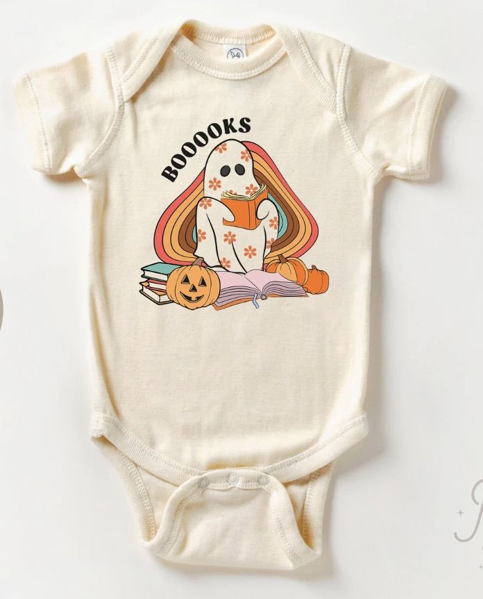 Retro style baby body suit with a ghost reading books.