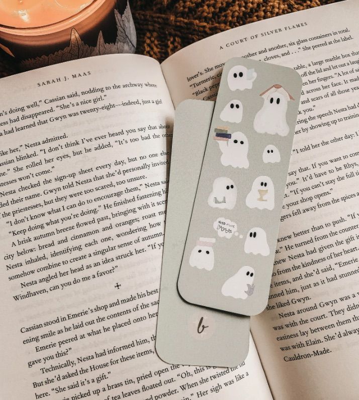 Image of a gray bookmark with ghosts on it. 