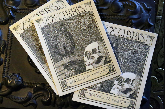 bookplates featuring an illustration of an owl and a skull