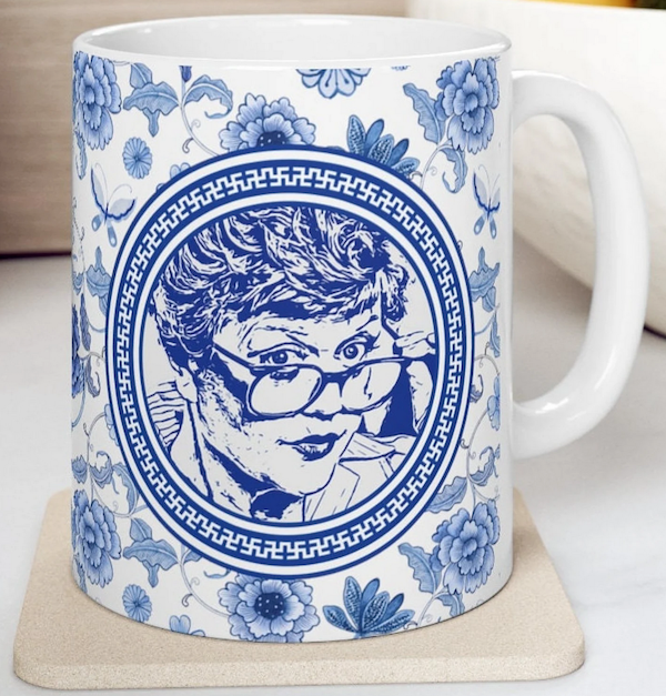 white mug with blue printed design of Angela Lansbury