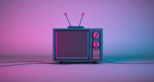 old fashioned tv in purple and blue toens