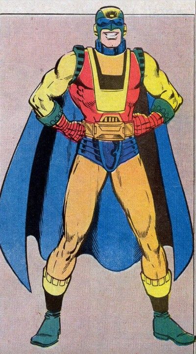 An image of Captain Ultra. He is wearing a garish costume with a green and yellow mask, blue goggles, a red shirt, yellow sleeves, orange tights, blue underwear, red gloves, green boots, and a blue cape. His fists are on his hips and he's grinning.