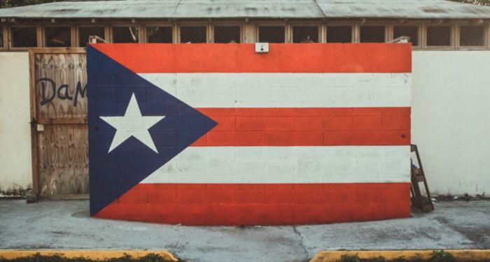 the flag of Puerto Rico painted on the wall of a building in old San Juan, PR