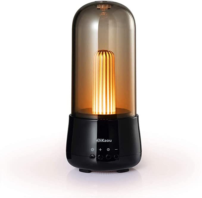 An old-fashioned looking light in a smoked glass bulb attached to a black base that has buttons for volume and brightness. 