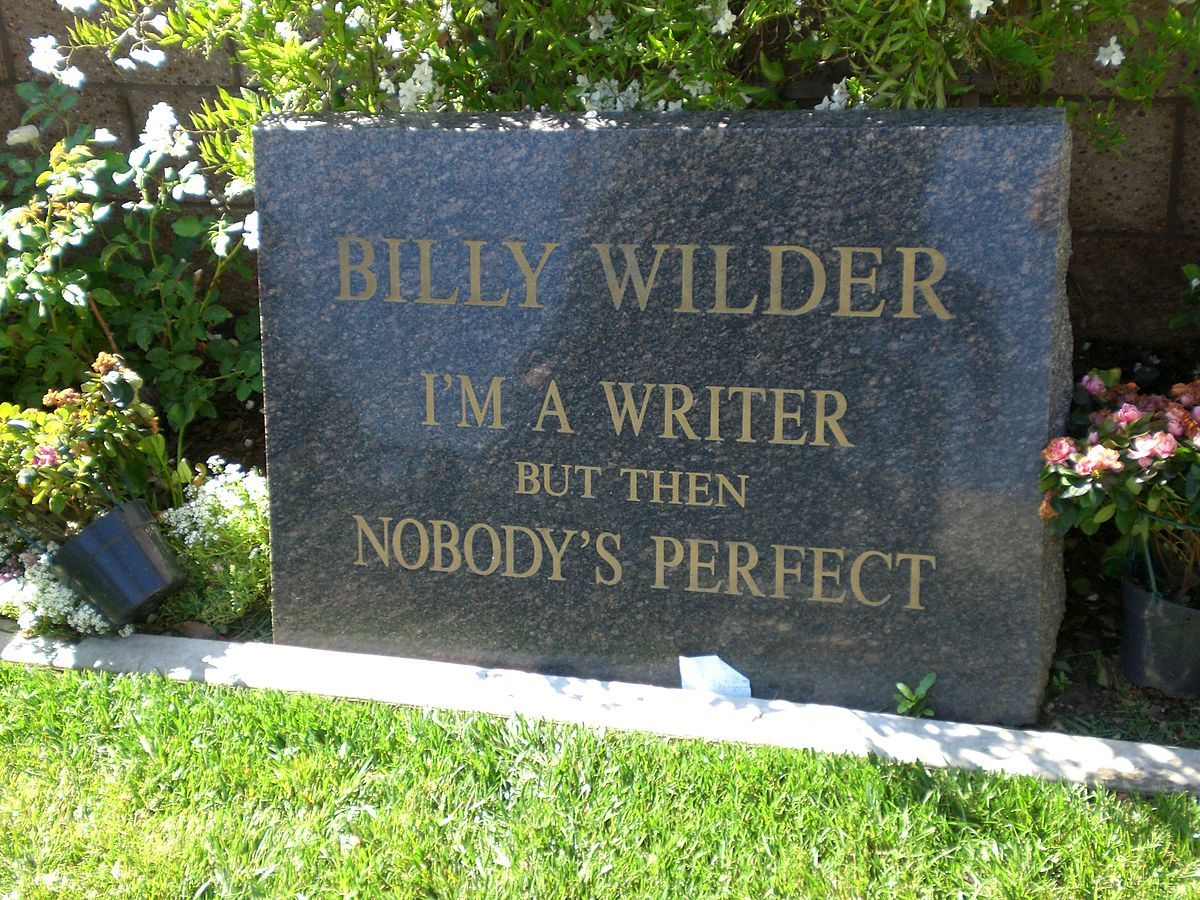 a photo of Billy Wilder's gravestone, which says in large letters, "I'm a writer but then nobody's perfect"