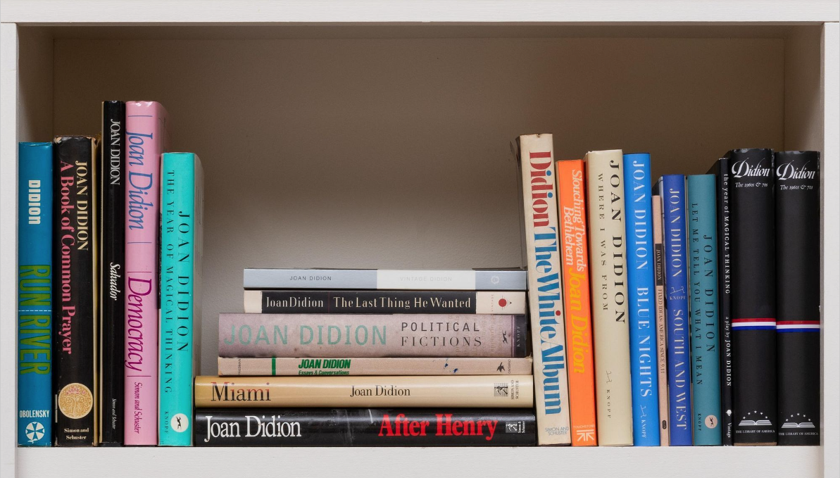 a shelf of Joan Didion books