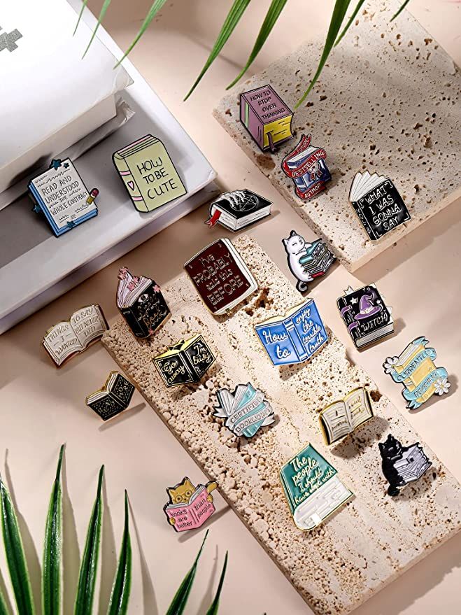 enamel pins in the shape of books