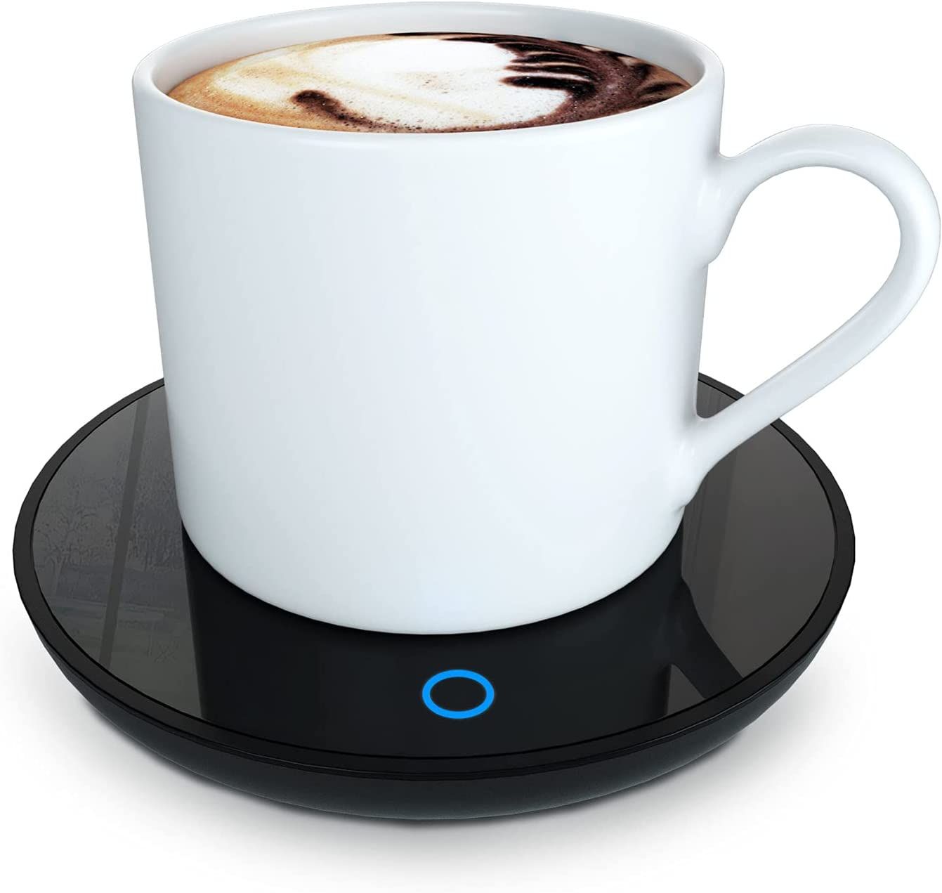 white coffee mug sitting on a black electric warmer