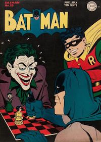 The cover to Batman #23, showing Batman and the Joker playing chess with pieces carved to look like them, while Robin watches.