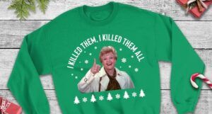 a green sweatshirt with a pine tree design and a picture of Jessica Fletcher grinning and giving a thumbs up. Above her is the text: "I killed them. I killed them all."