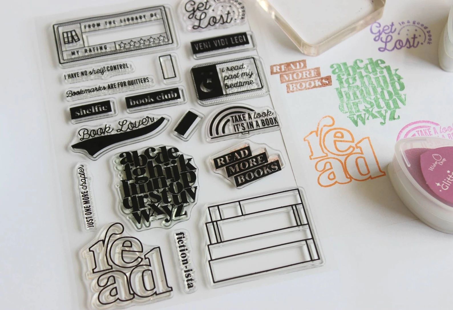 stamp set for book journaling including stacks of books and sayings about reading