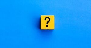 Image of a yellow block with a black question mark on a blue background