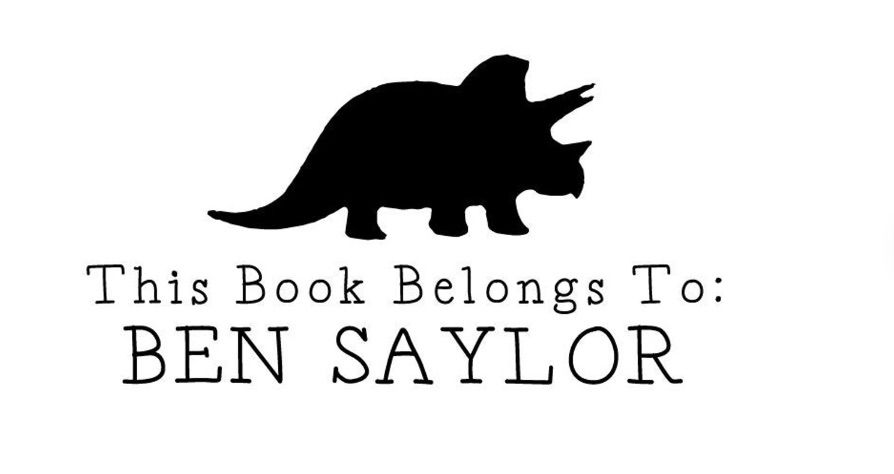 Image of a personalized book stamp. It has a triceratops and says "This book belongs to" with space to customize. 