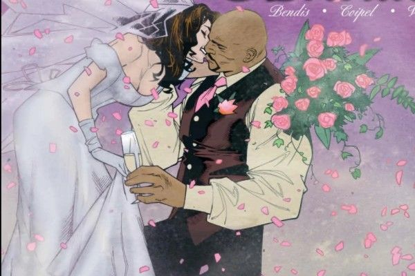 Part of the cover of New Avengers Annual #1. Jessica, in a wedding dress and holding a bouquet of pink roses, bends to kiss Luke, who is on one knee, wearing a tux (minus the jacket) and holding a glass of champagne. There are pink rose petals scattered around them.