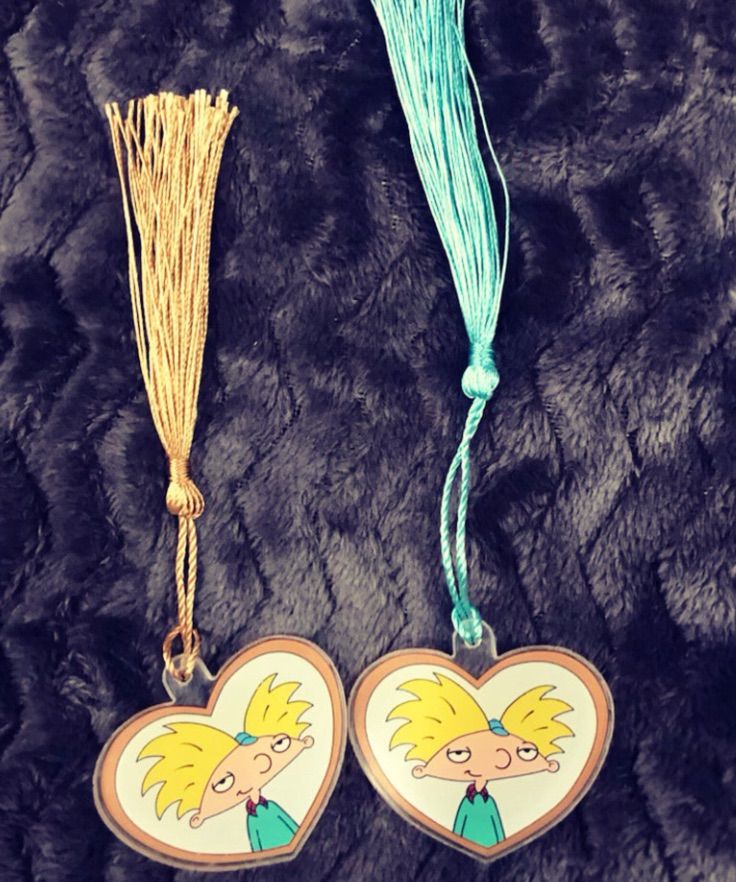 Image of two bookmarks featuring a heart and tassel. Inside the heart is an image of Arnold from Hey Arnold. 