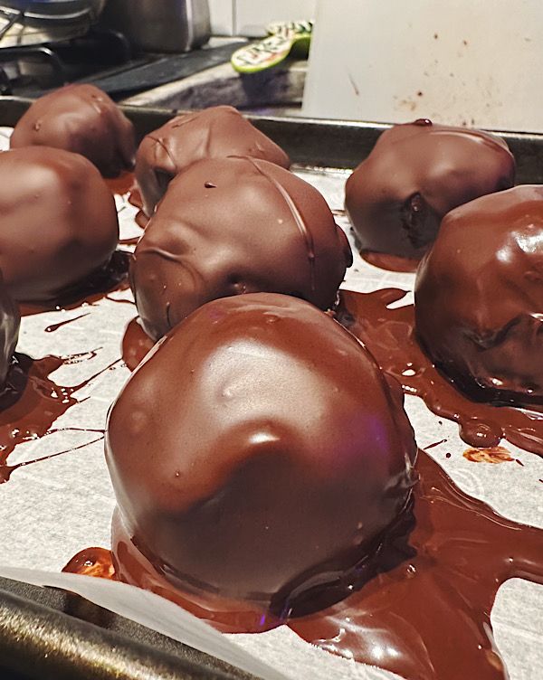 Chocolate truffles on a baking pan