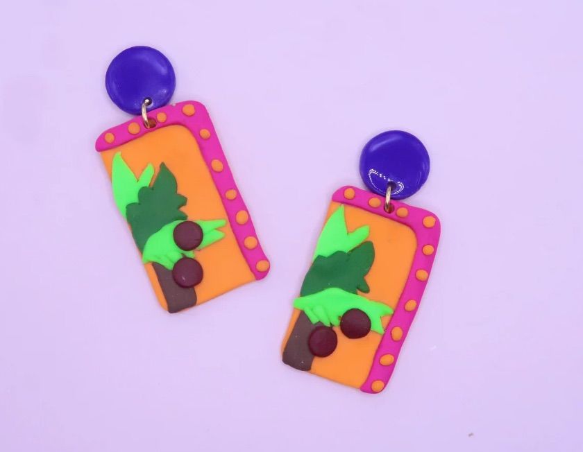 Image of earrings in the design of the cover of Chicka Chicka Boom Boom. 