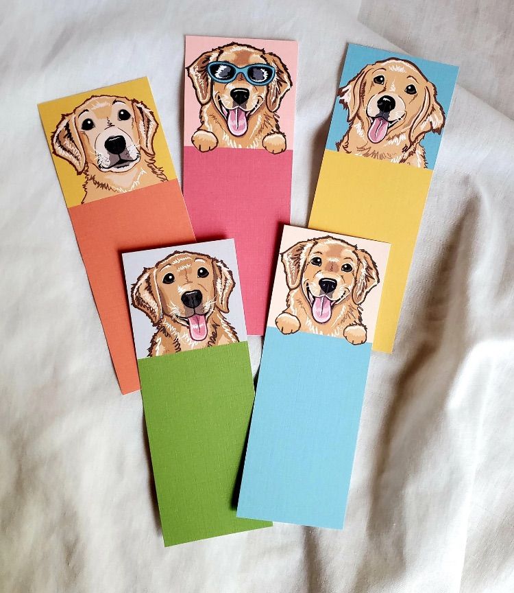 Image of 5 different colorful bookmarks featuring a golden retriever. 