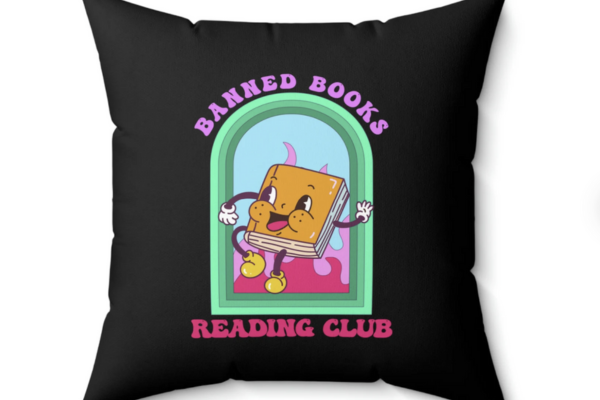 Black pillow with an illustration of a dancing book that reads "banned books reading club"