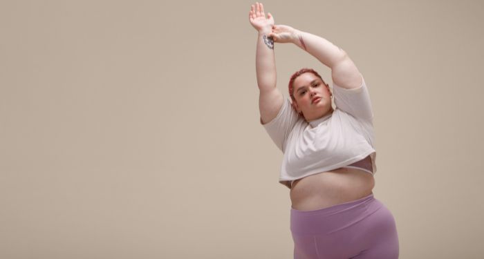 Image of a person with a bigger body stretching