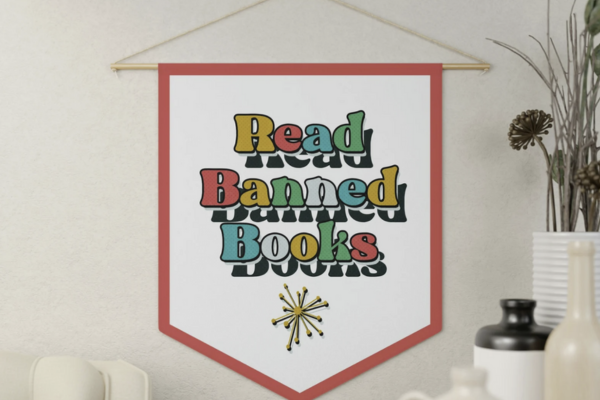 White banner with a red border and colorful text saying "read banned books"