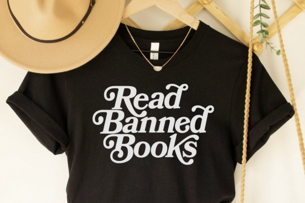Black shirt with white, curvy text that says "Read Banned Books"
