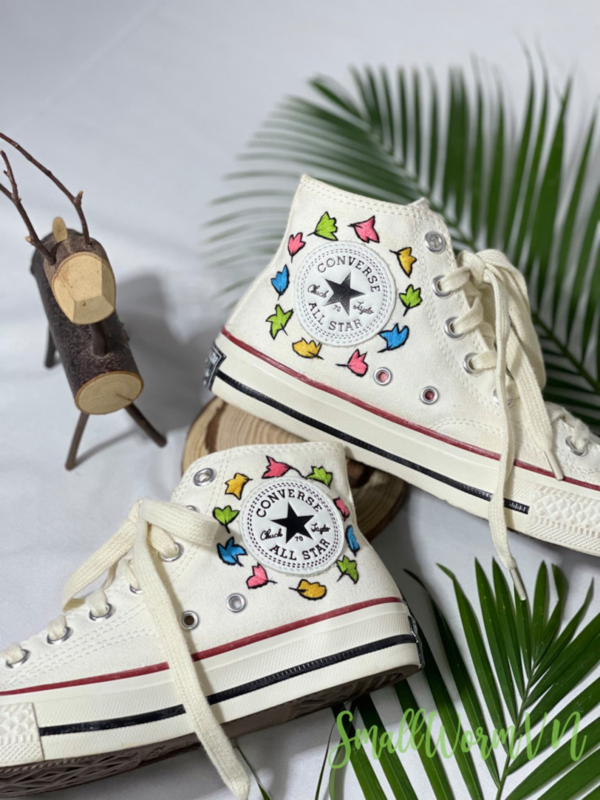 Personalized white converse with Heartstopper leaves around the logo
