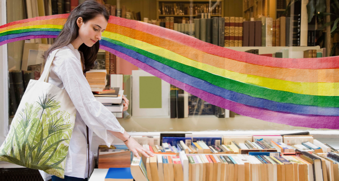 a photo of someone browsing books with a rainbow watercolor illustration superimposed behind them