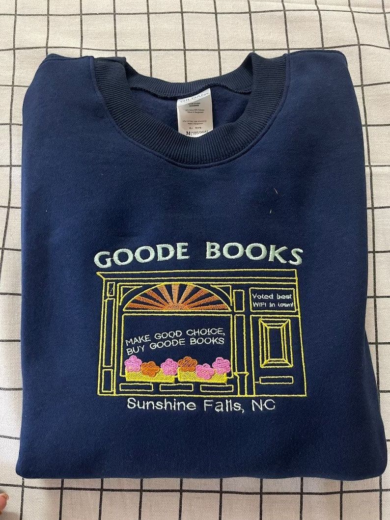 Navy blue sweatshirt embroidered with Goode Books logo