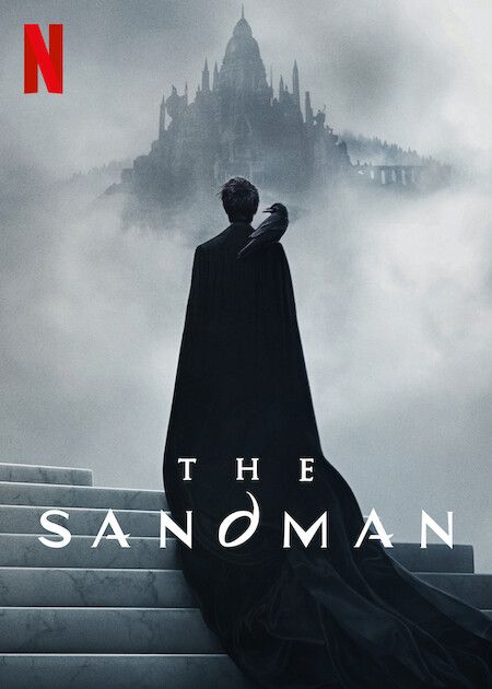 poster for Netflix's The Sandman featuring a figure in a dark cloak with a black bird on their shoulder gazing at a misty castle