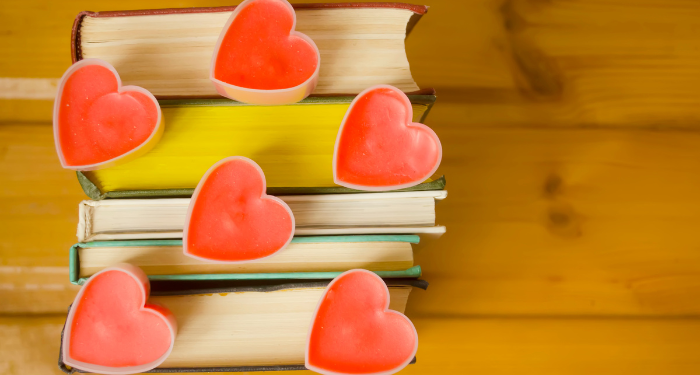 image of book edges with heart candles on top
