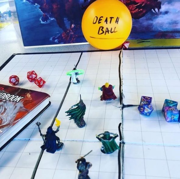 Dungeons and Dragons minis and map on a table