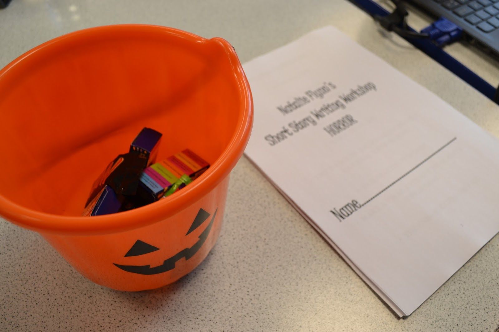 a photo of a jack o' lantern bucket and paper the title Short Story Writing Workshop: Horror