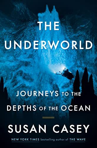 cover of The Underworld: Journeys to the Depths of the Ocean by Susan Casey; photo of a submersible investigating an ocean cave