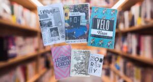 five zines against a blurred image of library stacks