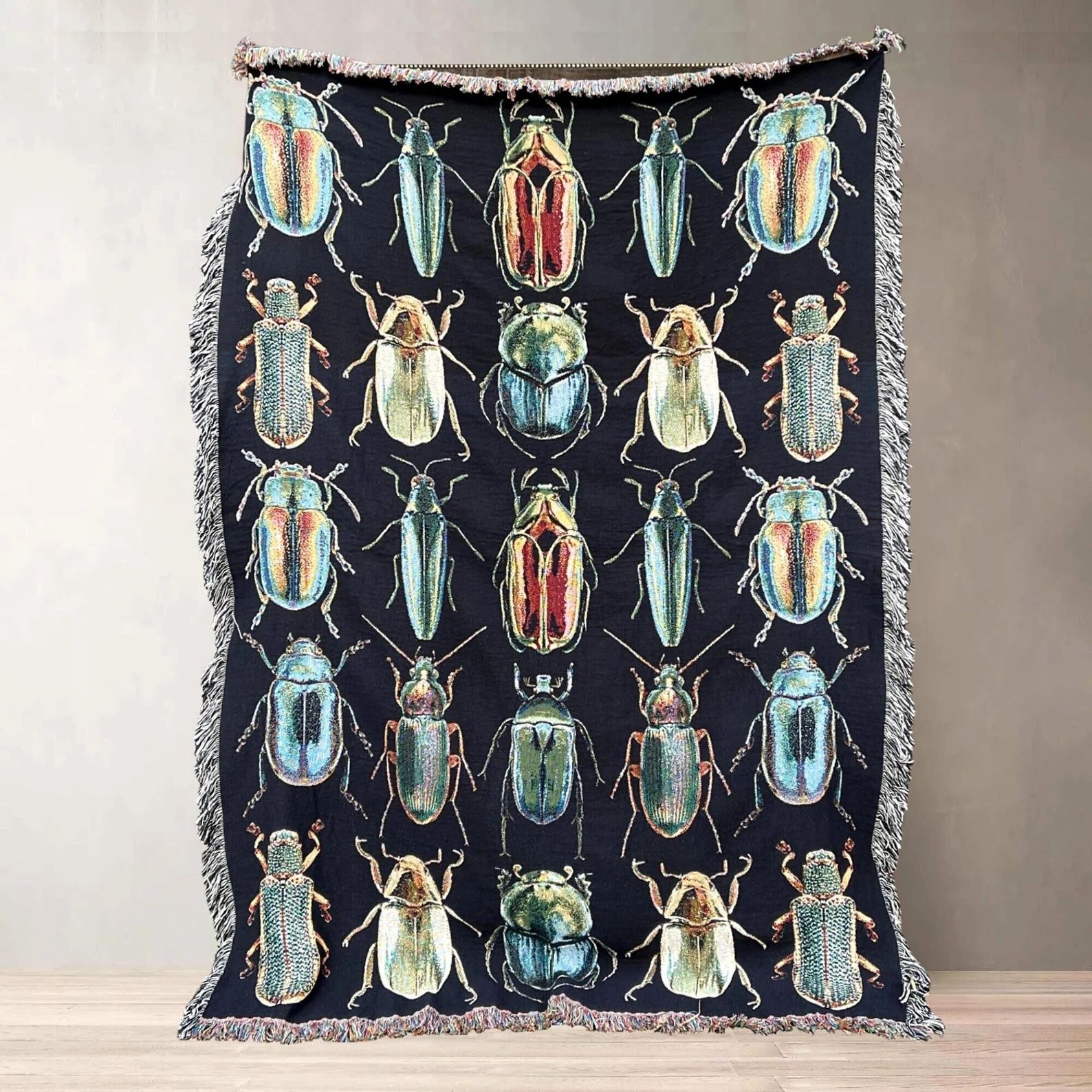 woven blanket with images of beetles printed on it