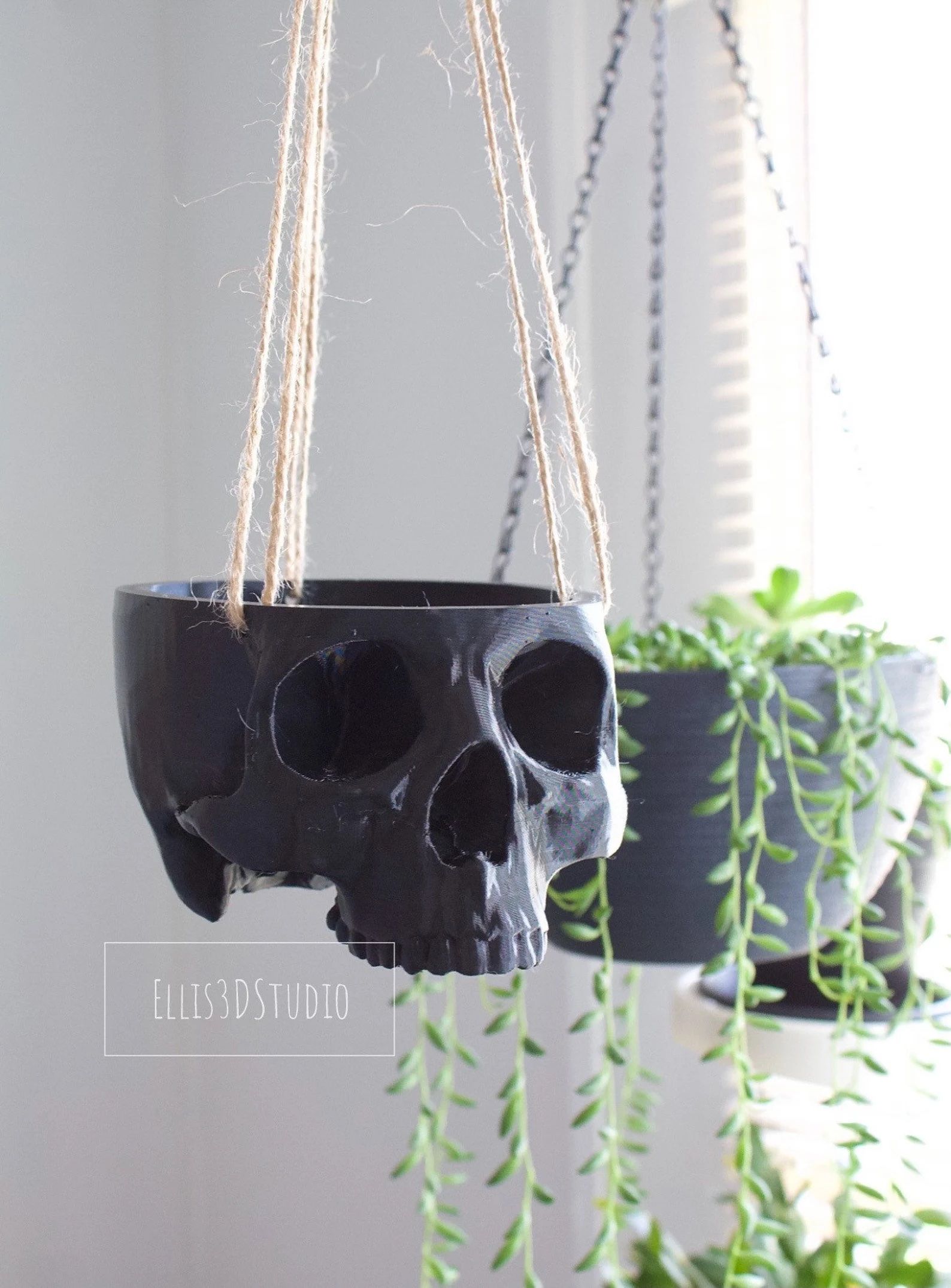 3d printed skull made into a hanging planter