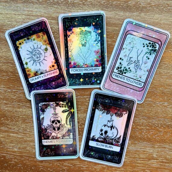 holographic tarot card stickers with bookish tropes on them