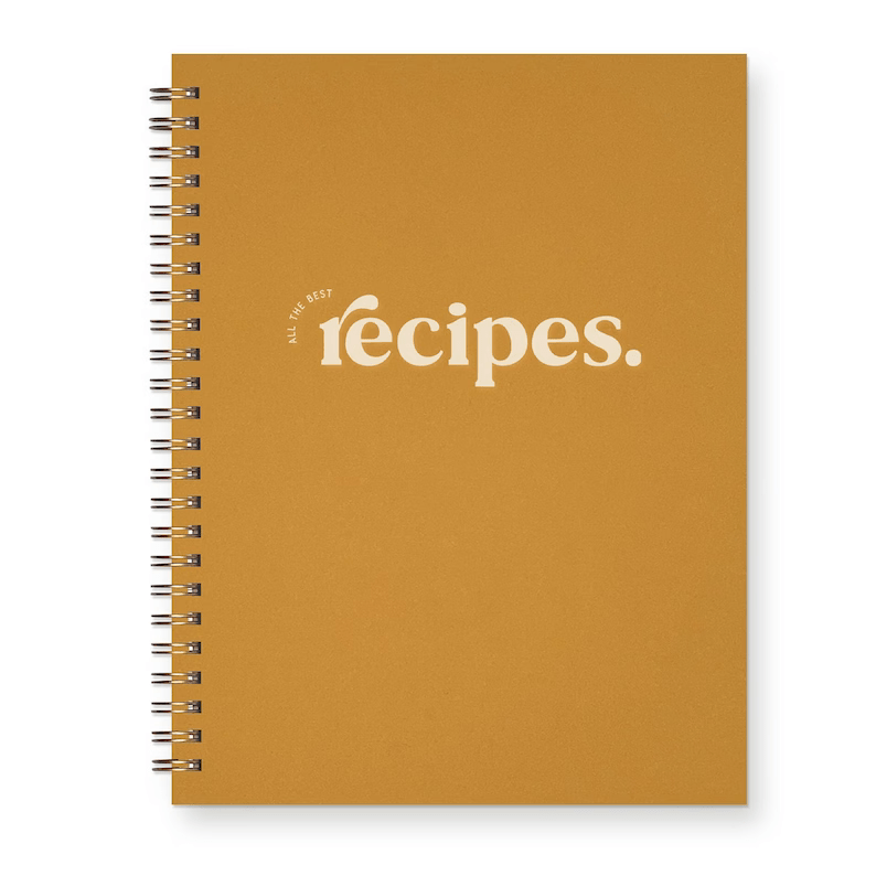 Photo of a yellow notebook with the word recipes on the cover