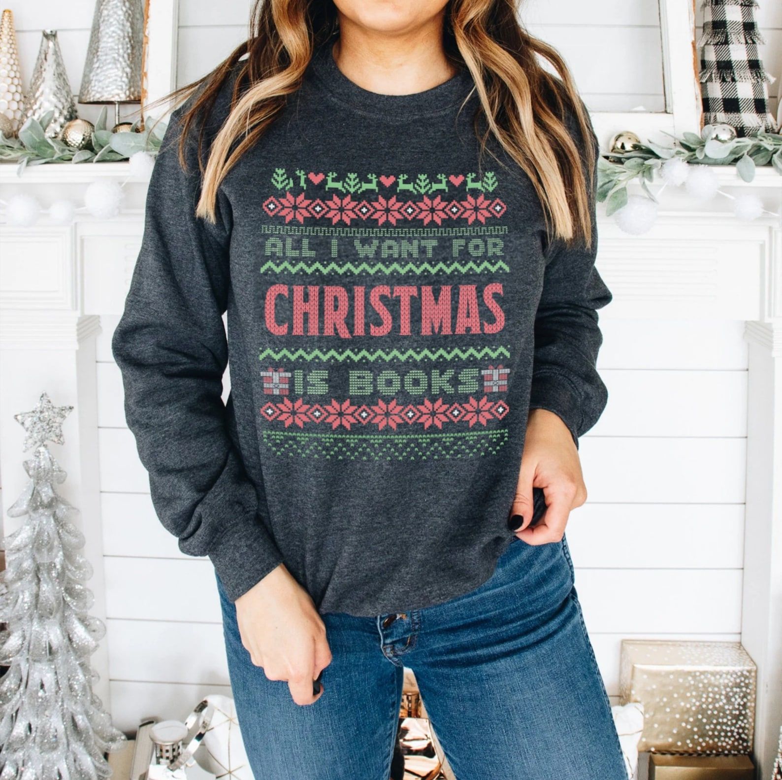 Dark gray sweater with a knit motif in red and green that reads "All I want for Christmas is books"