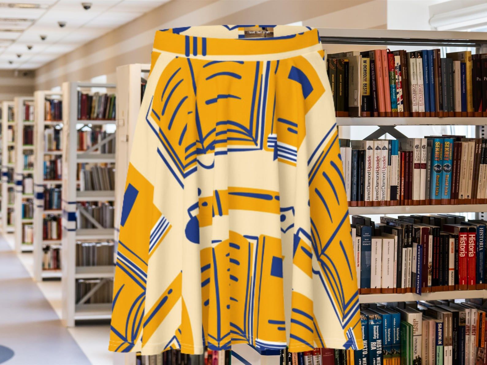 A cream skirt with yellow and blue illustrated books