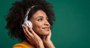 Image of a Black woman wearing headphones