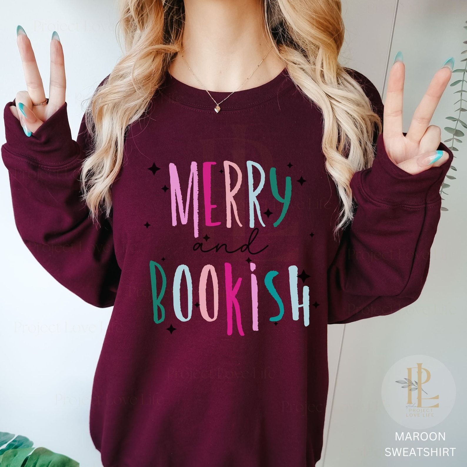 Maroons sweatshirt that reads "Merry and bookish"