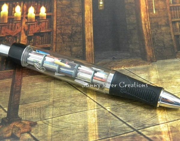 image of customised pen with miniature books and reading paraphernalia